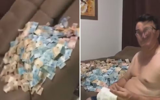 Suspeito de integrar grupo de agiotas ostenta montanha de dinheiro