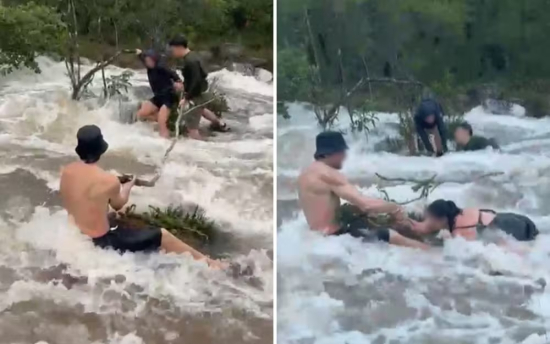 Turistas são surpreendidos por cabeça d'água e precisam segurar em pedras para não serem arrastados 